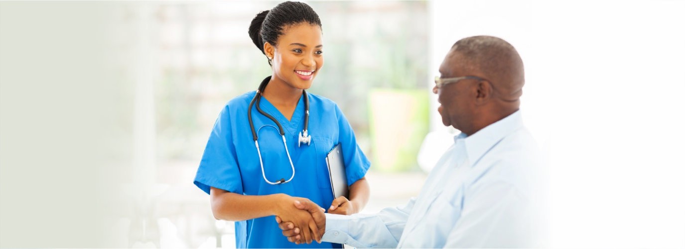 friendly african american medical nurse handshaking with senior patient